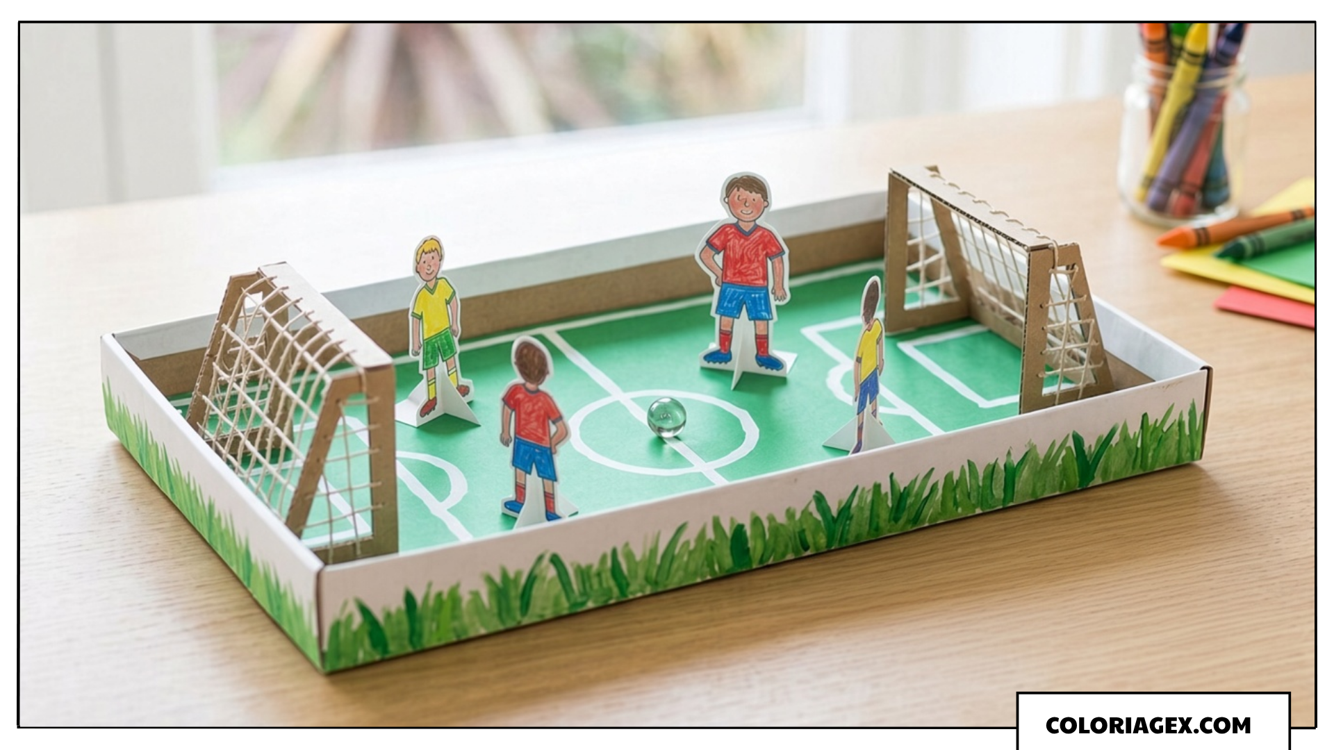 Mini terrain de foot dans une boîte à chaussures